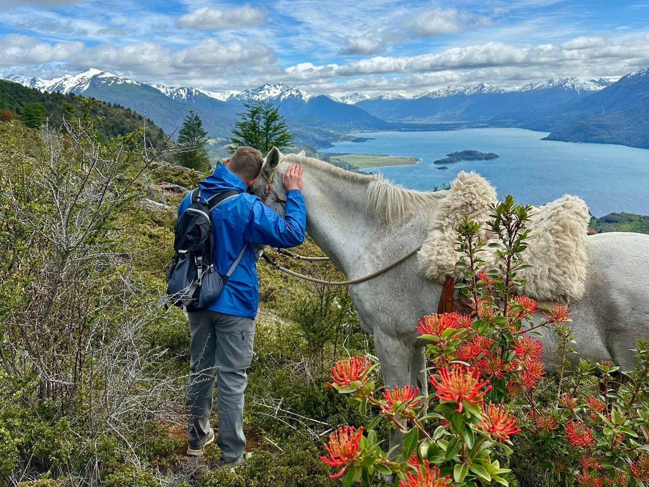 The group riding a mountain path, seen from behind